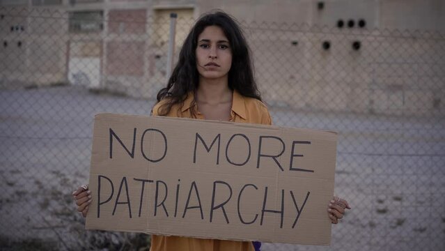Activist woman protesting on streets. Feminism concept.