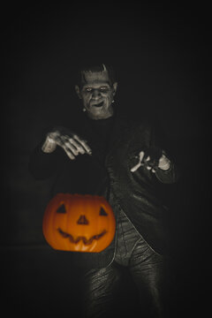 NEW YORK USA, SEPT 5 2022: Frankenstein monster looming with trick or treat jack o lantern pail - Neca action figure 