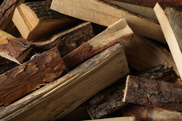 Cut firewood as background, closeup. Heating in winter