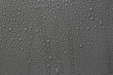 View of many water drops on grey background