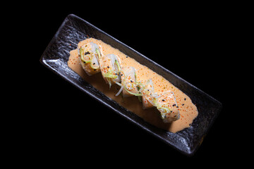 Sushi Maki, Breaded prawn, avocado, flambéed fan shells, parmesan cheese and butter.