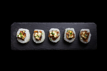 Sushi Maki, Breaded prawn, avocado, flambéed fan shells, parmesan cheese and butter.