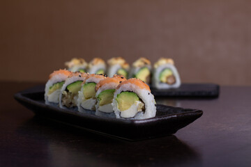 SALMON ROLL, Avocado filling with cream cheese and tenkatsu with salmon foil.