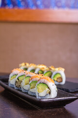 SALMON ROLL, Avocado filling with cream cheese and tenkatsu with salmon foil.