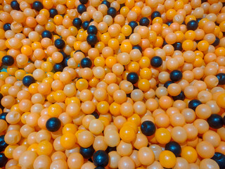 Black and yellow plastic balls
