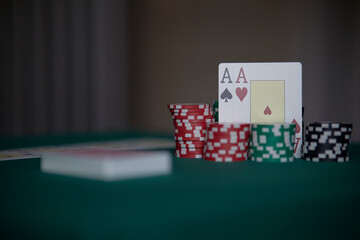 Dealer or croupier shuffles poker cards in a casino on the background of a table, chips. Concept of poker game, game business. Playing for money, a big win, a jackpot, gambling, a desire to get rich.	