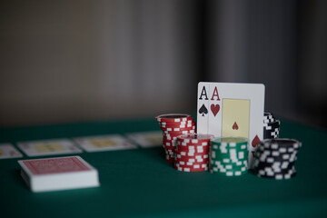 Dealer or croupier shuffles poker cards in a casino on the background of a table, chips. Concept of poker game, game business. Playing for money, a big win, a jackpot, gambling, a desire to get rich.	