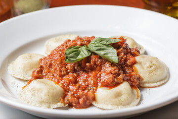 Delicious meat filled pasta on a plate. Italian cannelloni, Spanish cannelloni. - Image