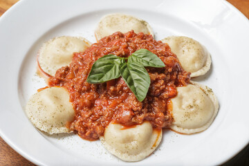 Delicious meat filled pasta on a plate. Italian cannelloni, Spanish cannelloni. - Image