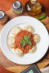 Delicious meat filled pasta on a plate. Italian cannelloni, Spanish cannelloni. - Image