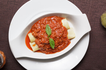 Delicious meat filled pasta on a plate. Italian cannelloni, Spanish cannelloni. - Image