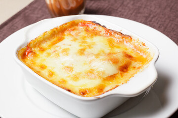 Traditional italian lasagna with vegetables, minced meat and cheese.  - Imagen