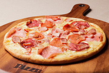 Delicious pizza served on wooden plate  - Imagen