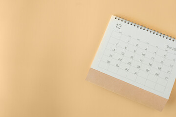 close up of calendar on the yellow table background, planning for business meeting or travel planning concept