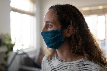 Caucasian woman spending time at home self isolating and social distancing in quarantine lockdown du