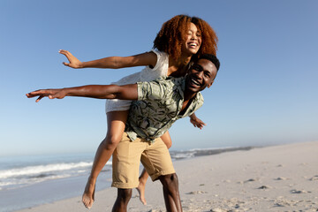 Happy couple spending time together on the beach