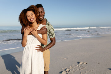 Happy couple spending time together on the beach