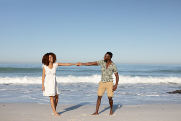 Happy couple spending time together on the beach