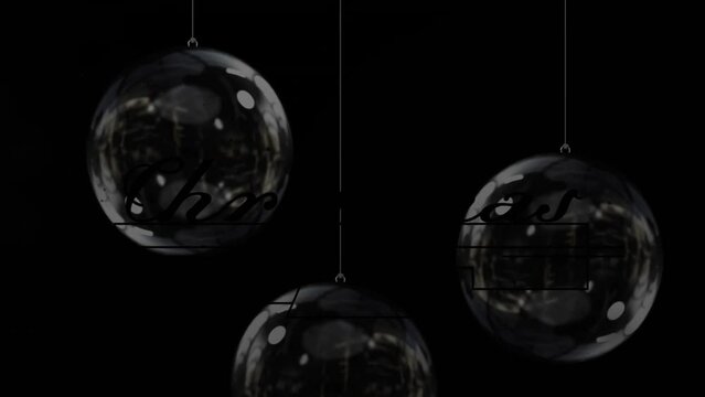 Animation of gold glowing christmas text over christmas decorations baubles on black background