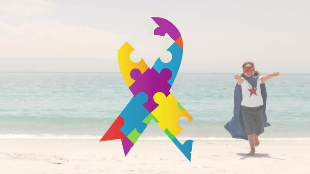 Animation of Autism Awareness Month symbol with boy dressed as superhero - Powered by Adobe