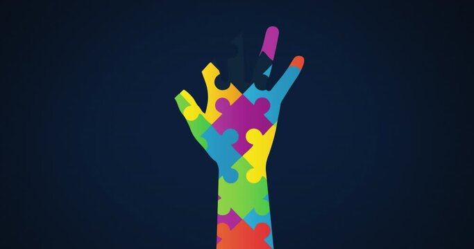 Animation of multi coloured puzzle elements forming hand, symbol of Autism Awareness Month symbol 