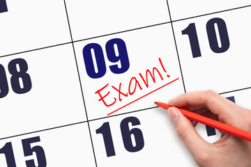9th day of the month. Hand writing text EXAM and drawing a line on calendar date.
