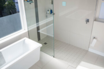 Fototapeta na wymiar High angle view of empty bathtub by glass