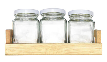 glass bottle on wooden tray isolated on white background