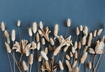 Dry flowers and pampass grass frame mockup top view on dark blue  background with copy space.Autumn...