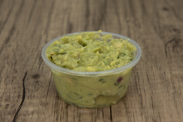 Authentic Mexican flavor side dish appetizer of guacamole to complete the dinner meal