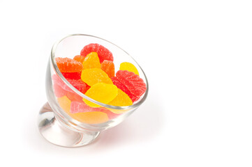 Jelly sweets citrus mix unglazed lying in a round glass bowl.