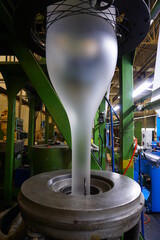 LDPE. extrusion blown film machine showing bubble extruded from die head through bubble stabilizer...