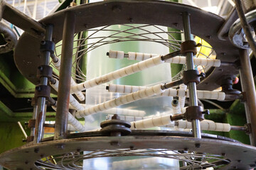 LDPE. extrusion blown film machine showing bubble extruded from die head through bubble stabilizer and steel roller.