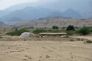 landscape of a nomad camp in the desert in the middle east