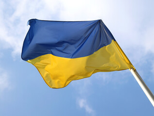 big flag of ukraine with blue and yellow colors waving