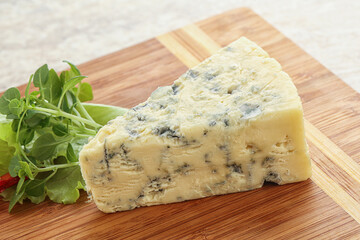 Blue cheese piece over board