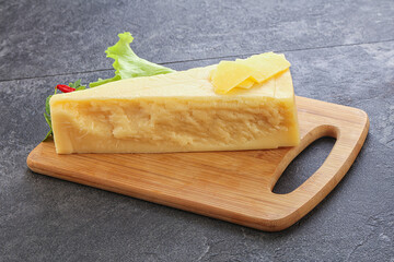 Parmesan cheese piece over board