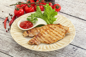 Grilled pork steak with ketchup