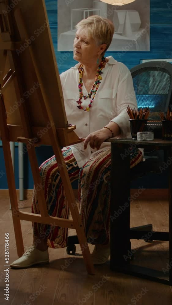 Fototapete vertical video: professional retired person drawing artistic vase model using design tools to create