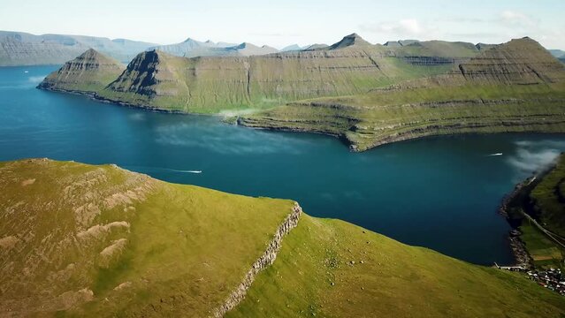 Aerial view of a Funningur Scenic Point, Faroe Islands. Sunny day in summer. Amazing nature in Faroe Islands. Eysturoy Island. Gonguturur or Hvithamar Trailhead. High quality 4k footage