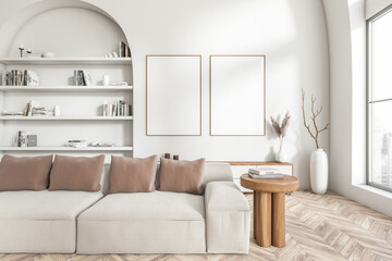 Bright living room interior with two empty white posters