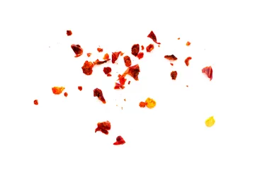 Fotobehang Chili Pepers Dried chili flakes and seeds isolated on white background, top view. Red pepper isolated on white background, top view. Pieces of red pepper isolated on white background, top view.  © aneriksson