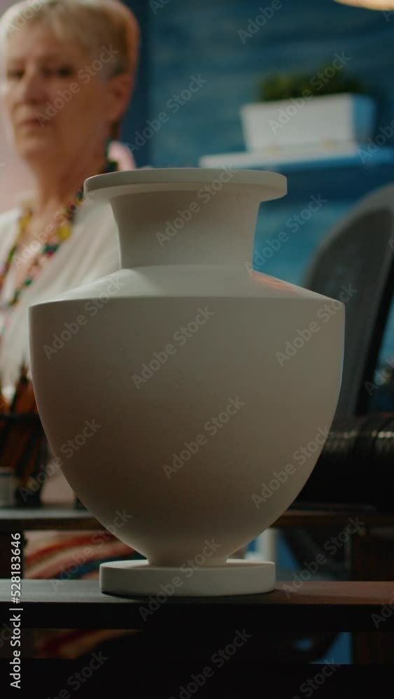 Poster vertical video: authentic vase model on table to create professional artwork masterpiece during arti