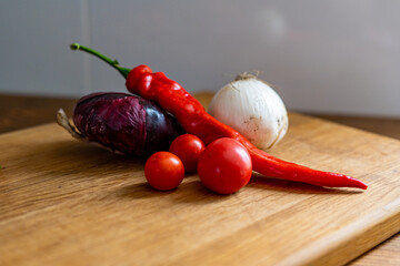 red and white onions on a wooden cutting board