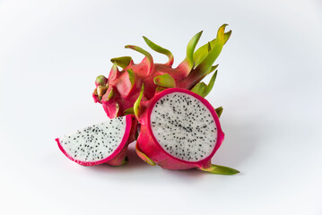 Obraz na płótnie Canvas Fresh and sliced dragon fruit on white background.