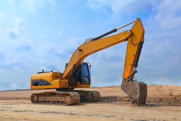 Fototapeta na wymiar excavator or backhoe on construction site and sky background