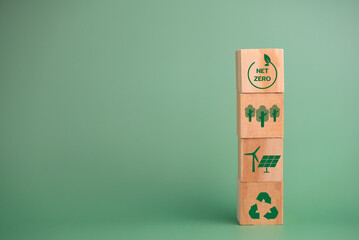 Net zero green technology innovation eco carbon renewable energy business concept with wood cube blocks.