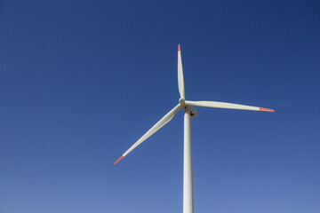 Fototapeta premium Wind turbine power is a clean, renewable source of energy that has become increasingly popular in recent years.