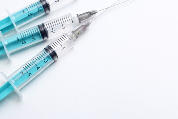 Medical syringe on a white background. A syringe for injection. The concept of health and beauty