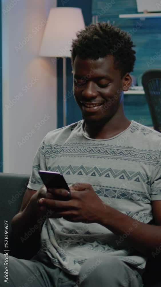 Poster vertical video: business man holding smartphone with text messages. person with technology using pho